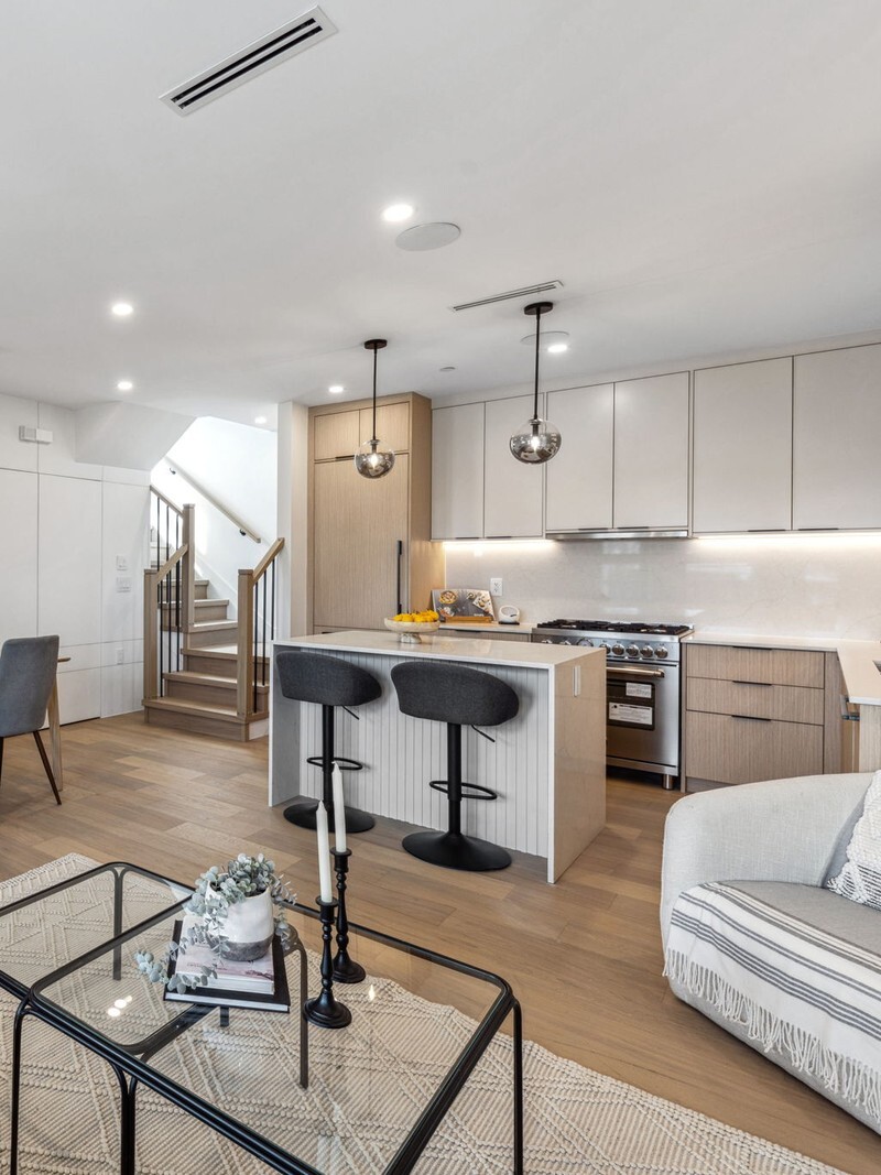 Vancouver open concept living room, dining area, and kitchen with wood floors