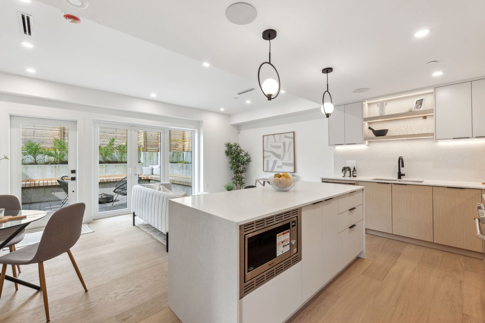 Vancouver kitchen island with quartz counters and stainless range