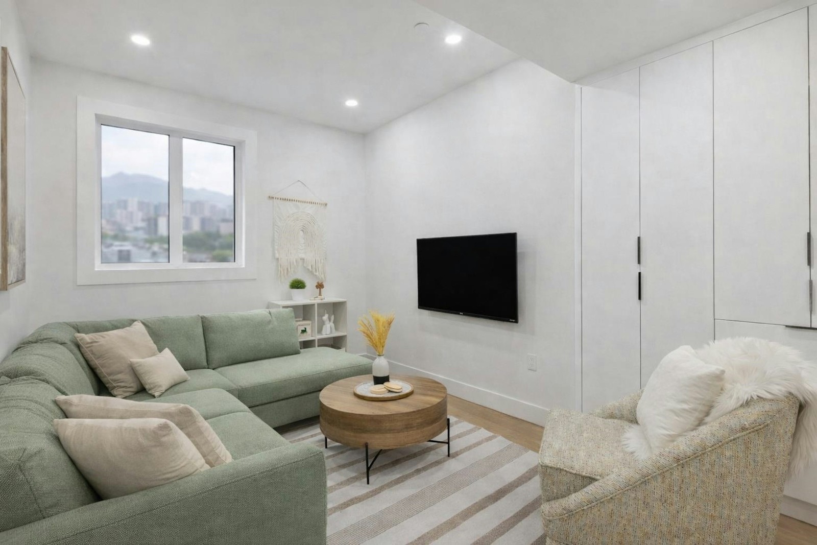 Vancouver media room with green sectional sofa and city view window