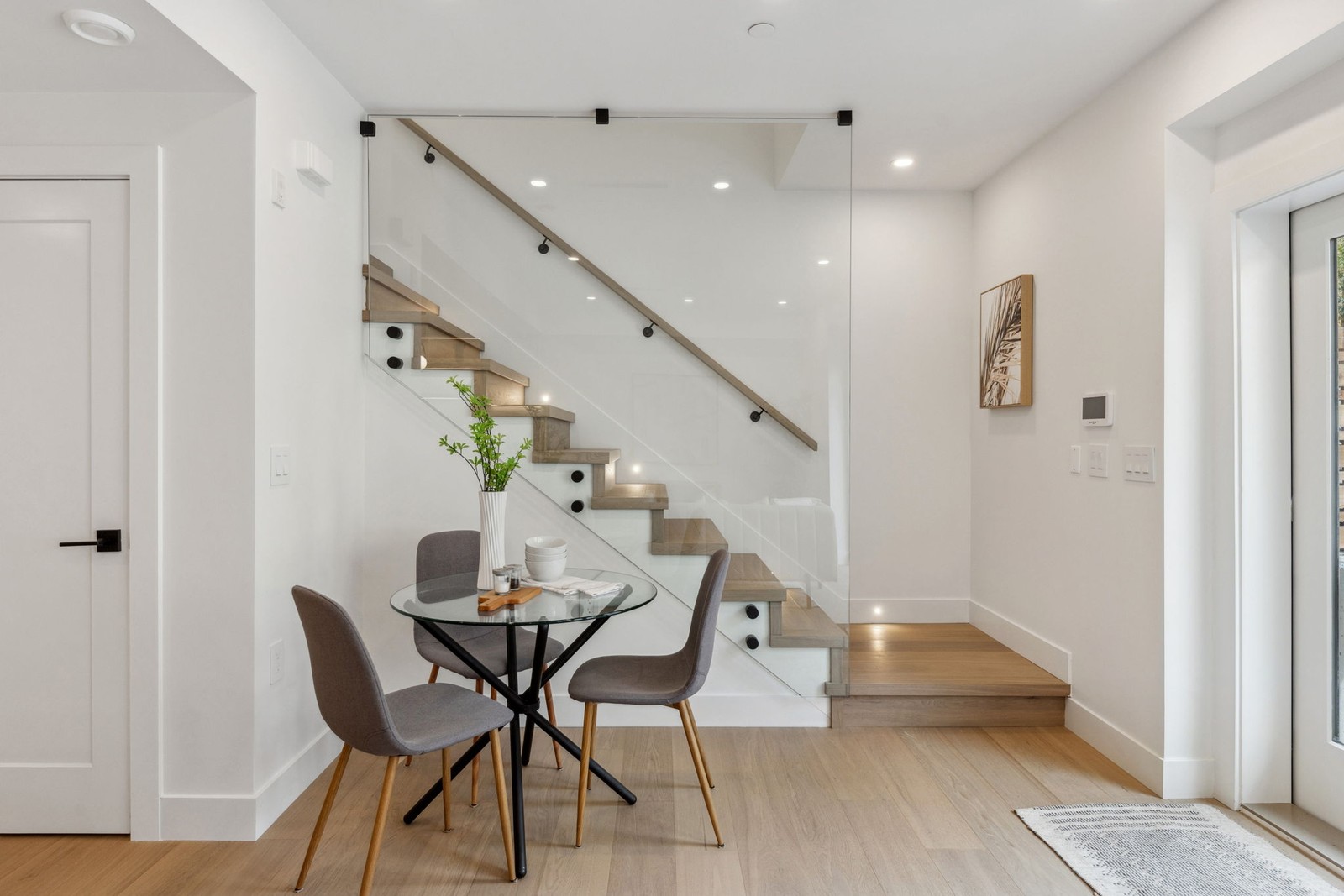 Vancouver living room and kitchen with dining table and potted plants