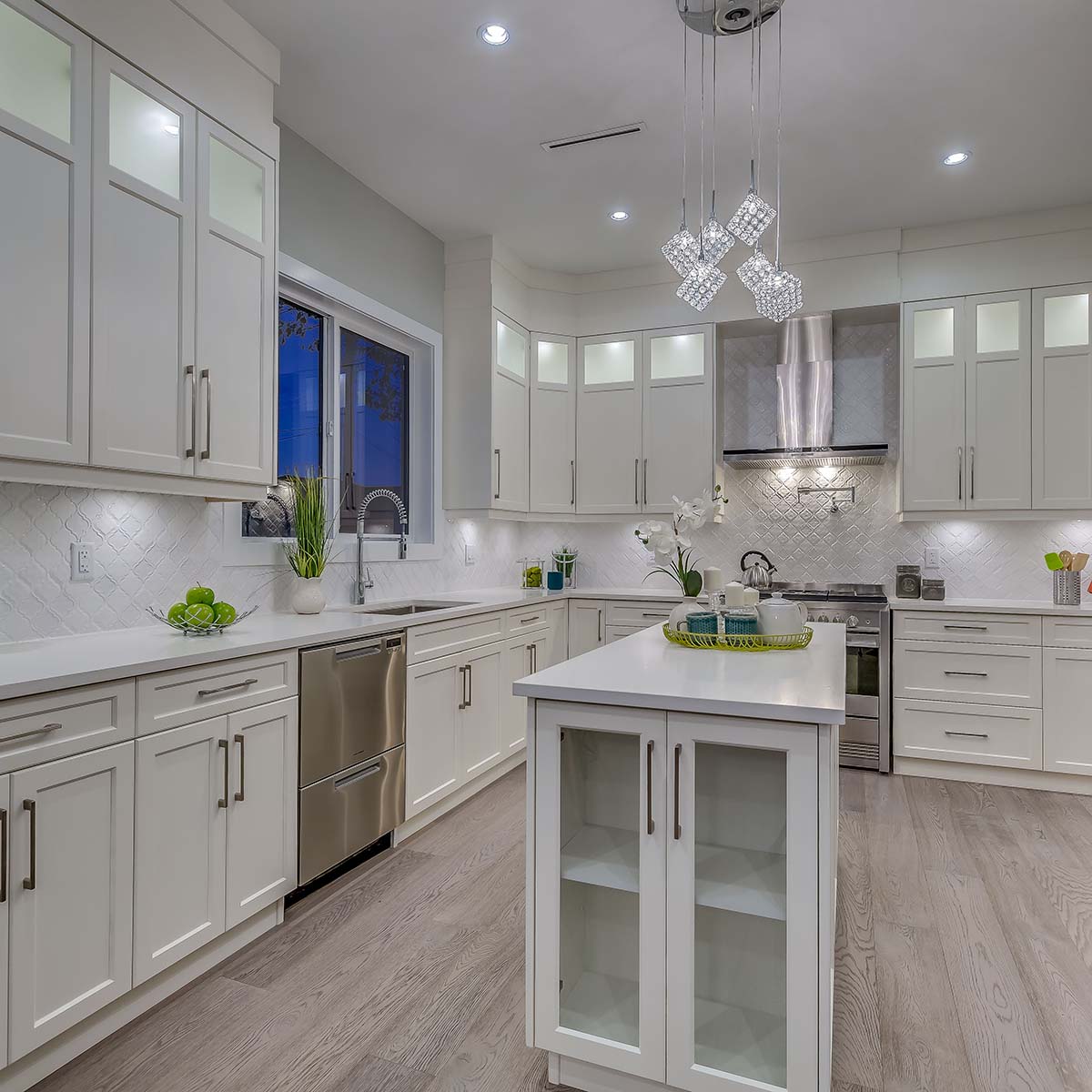 Contemporary kitchen in a custom home with sleek cabinetry and state-of-the-art appliances.